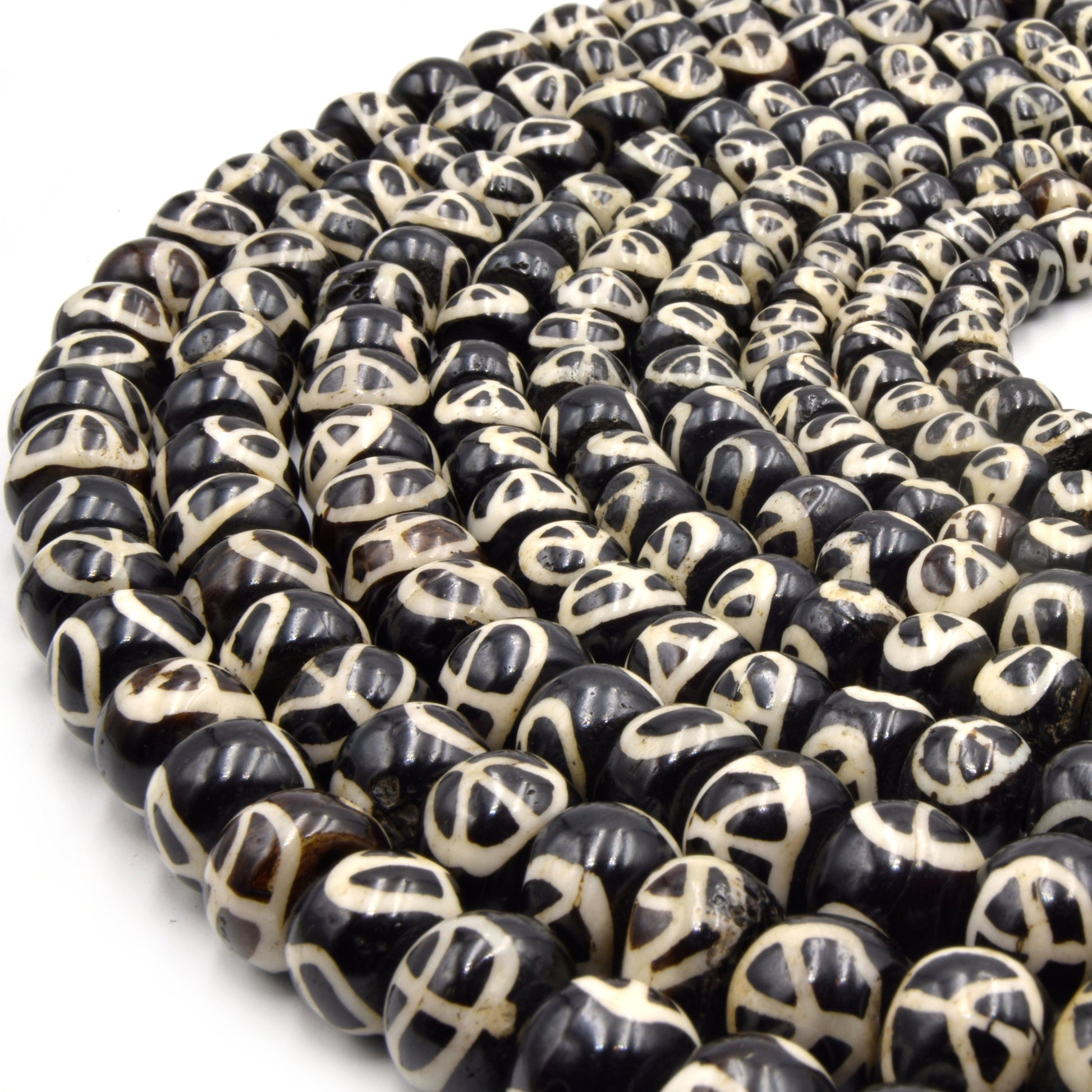 dark brown peace sign painted bone beads