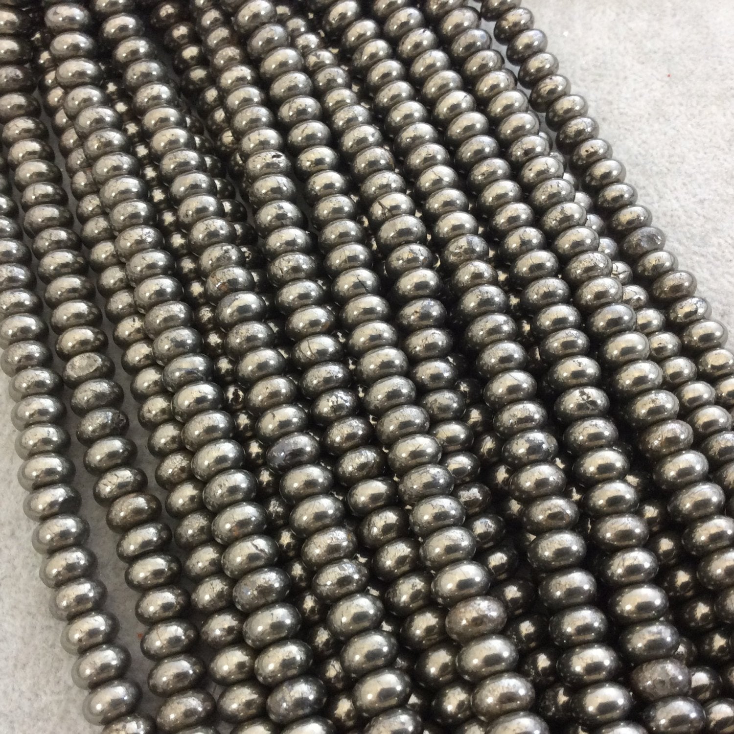 5mm x 8mm Smooth Natural Metallic Pyrite Rondelle/Disc Shaped Beads with 1mm Holes - Sold by 15.75" Strands (Approximately 80 Beads)