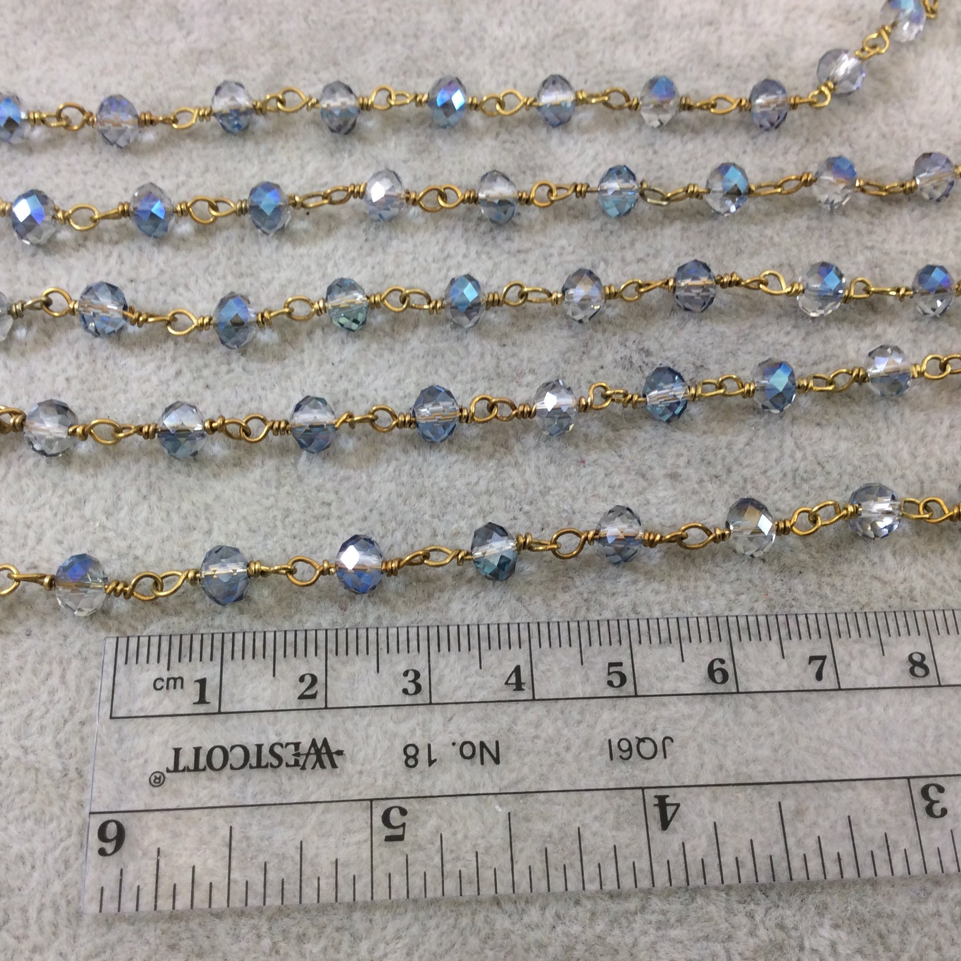 Gold Plated Copper Wrapped Rosary Chain with 6mm Faceted Trans. Blue & Gray Glass Crystal Rondelle Beads - Sold by the Foot (RC46-096-GD)