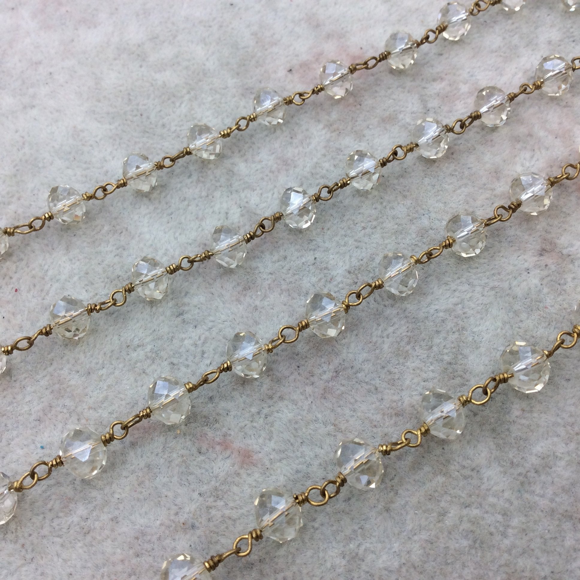 Gold Plated Copper Wrapped Rosary Chain with 6mm x 8mm Faceted Transparent Clear Glass Crystal Rondelle Beads- Sold By the Foot (CC68-01-GD)