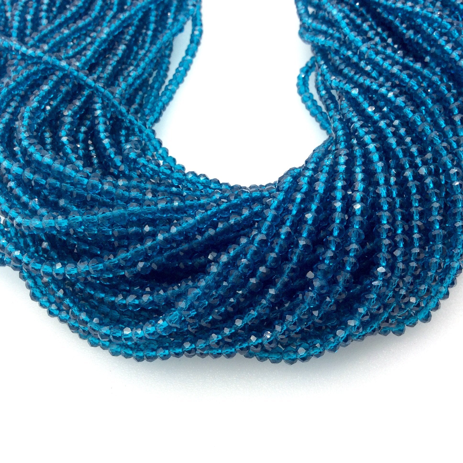 2mm x 3mm Faceted Tansparent Teal Blue Chinese Crystal Rondelle Shaped Beads - Sold by 16" Strands (Approx. 150 Beads)