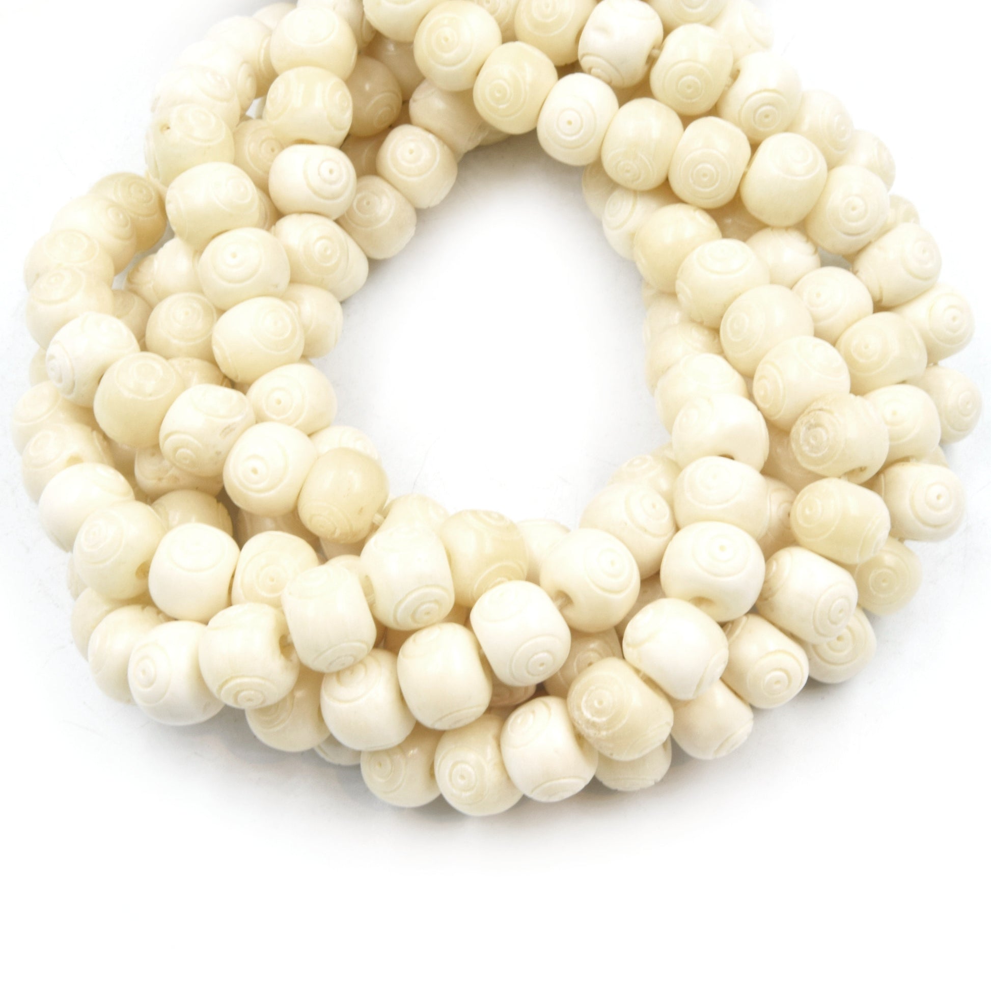 white bone beads bullseye carving